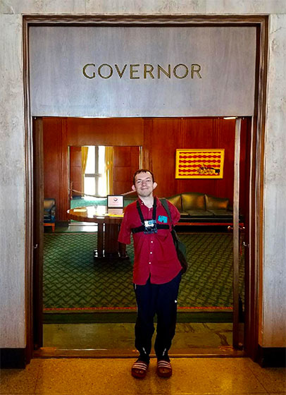 Michael Trimble standing outside the Oregon state governor's office.
